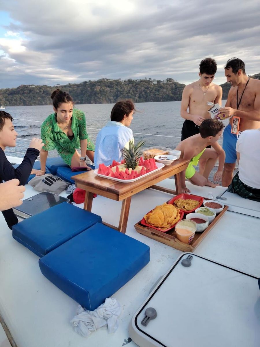 Family and friends around the fresh food spread