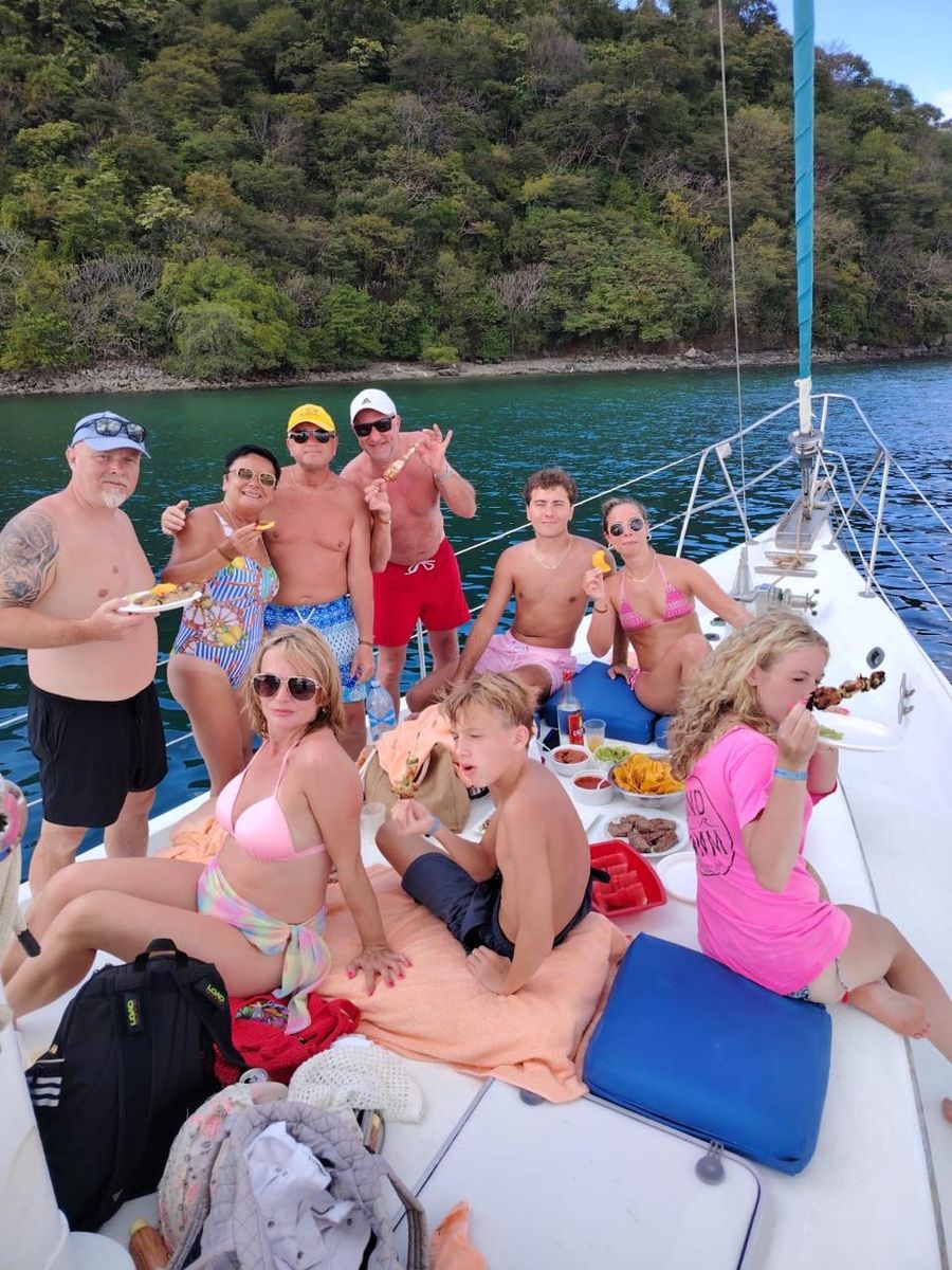 Guests celebrating with food and drinks on deck