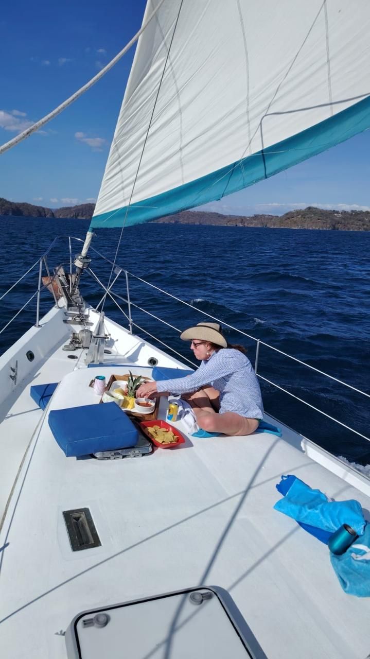 Relaxing on the bow deck under sail